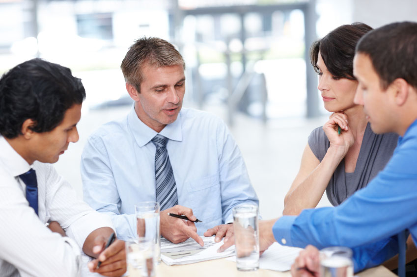 Human Resource professionals talk during meeting